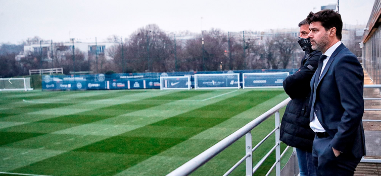 Mauricio Pochettino and Miguel D’Agostino survey the pitches at PSG's training ground
