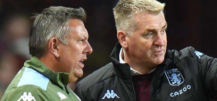 Dean Smith (right) arrives at Carrow Road with assistant Craig Shakespeare (left)