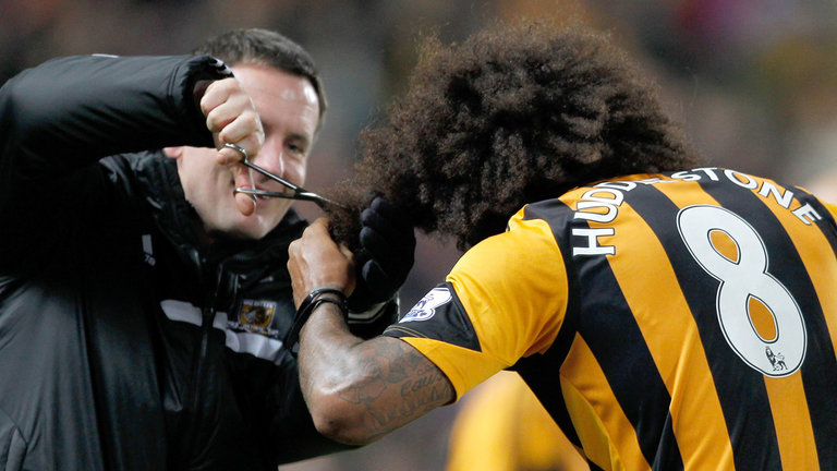 Price doing a spot of hairdressing with Tom Huddlestone at Hull