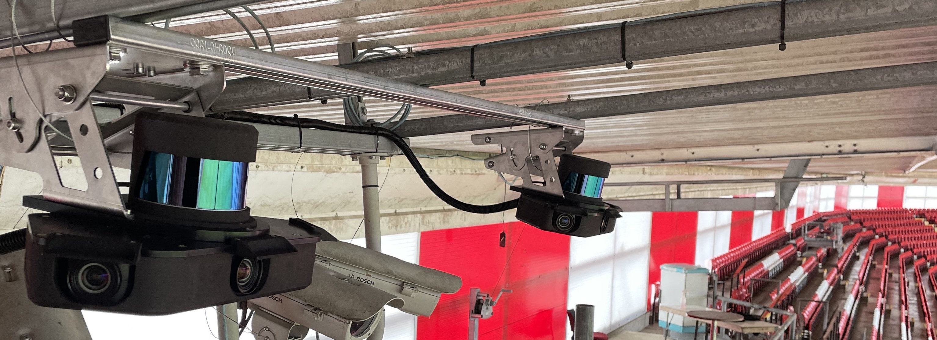 The Sportlight system at St Mary's Stadium. There are two LiDAR cameras. Each has a shiny LiDAR sensor, which is tracking everything that happens on the pitch in 3D. Underneath are three cameras that use computer vision to identify players. 