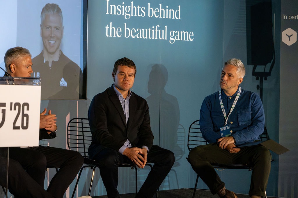Simon Wilson, Ross Wilson and Leigh Bromby sitting on a stage